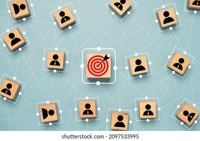 Red dartboard and black arrow connection linkage with human icon for customer focus target group and customer relation management concept. - Shutterstock ID 2097533995