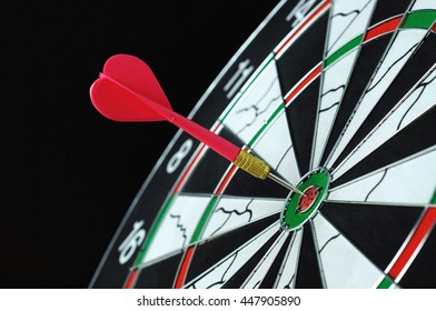 Red darts hits on dartboard target - Shutterstock ID 447905890