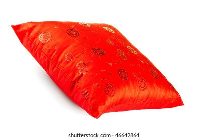 red decorative pillow with pattern isolated on white