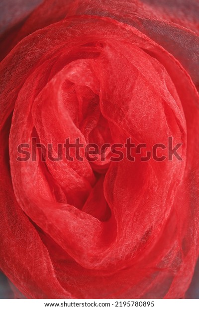 Red delicate fabric shaped as woman\
vagina, intimate and erotic consept, vulva\
symbol