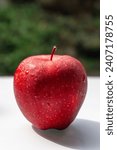 Red Delicious is a type of apple with a red exterior and sweet taste that was first recognized in Madison County, Iowa, in 1872