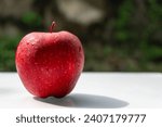 Red Delicious is a type of apple with a red exterior and sweet taste that was first recognized in Madison County, Iowa, in 1872