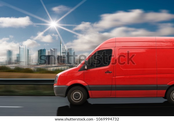 Red Delivery Van On Road Stock Photo (Edit Now) 1069994732