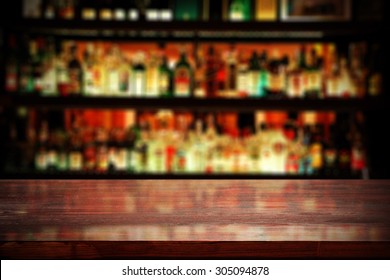 Red Desk Top In Blurred Bar Background 