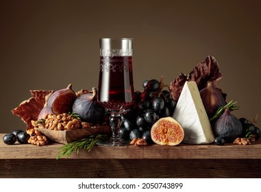 Red Dessert Wine With Cheese Brie And Fruits On A Wooden Table. Copy Space.