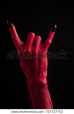 Red devil hand making devil horn hand sign