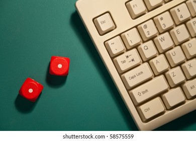 Red Dice and computer keyboard, concept of gambling