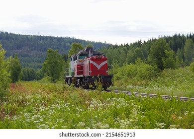 Red Diesel Locomotive In A Summer