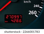 red digital odometer of an old car with red digits, considerable mileage, mileage