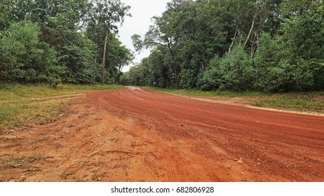 Red Dirt Road Into Rainforest Of Cape York Australia