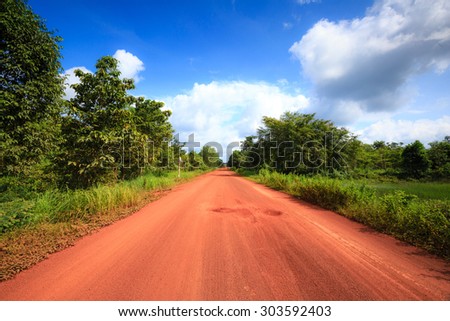 Red dirt road in the tropical jungle