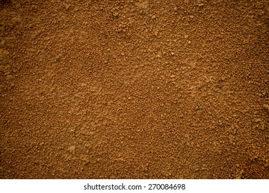 Красный грязь (почва) фон или текстура.