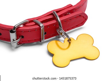 Red Dog Collar With Gold Dog Tag Isolated On White.