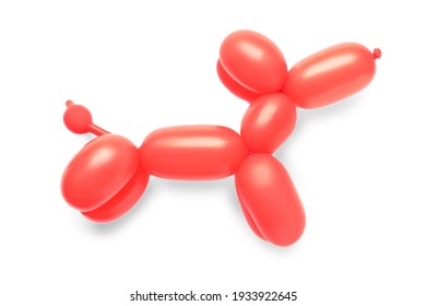 Red dog figure made of modelling balloon on white background, top view