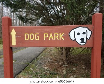 Red Dog Park Sign With White Dog And Asphalt Trail