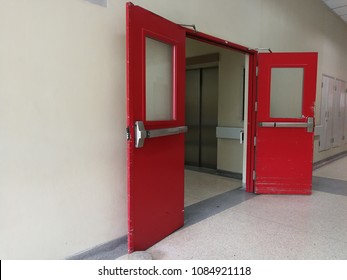 The Red Door Is A Fire Exit And Exit Of The Hospital Elevator, Fast Transport Of Goods, Transport Of Patients, Medicine And Medical Equipment On High Buildings.