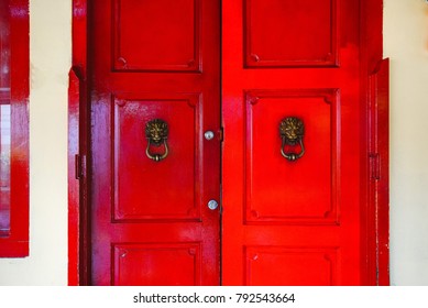 The Red Door With The Lions. Double Doors.