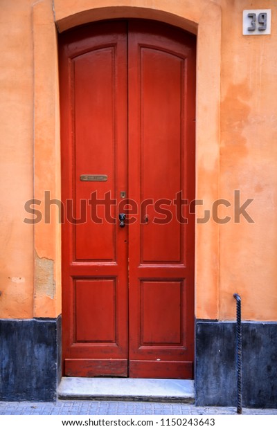 Red Door On Background Orange Wall Stock Photo Edit Now 1150243643