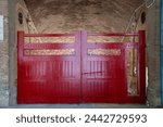 Red doors leading into the Valencia bullring, known as Plaza de Toros de Valencia or officially Plaça de bous de València. A bullring still used for bullfighting. Perfect for background design concept