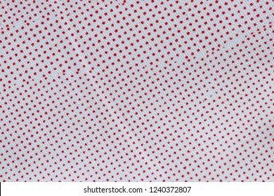 Red dots circles on pattern of white fabric texture . Background for winter time. 