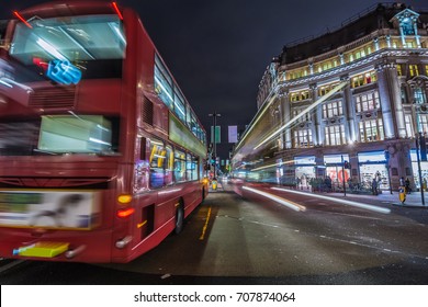  Red Double-decker Bus. Pedestrian And Traffic In Oxford Circus At Night In London, UK