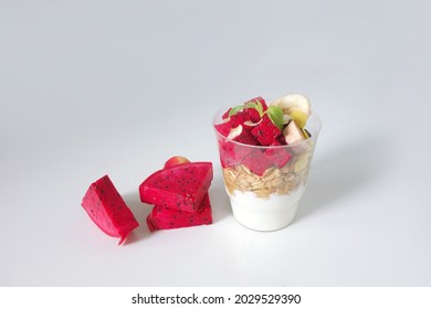 Red Dragon Fruit Mixed Yogurt With Grain Wheat Healthy Breakfast. Fresh Fruity Yoghurt Dessert Isolated Onwhite Background 