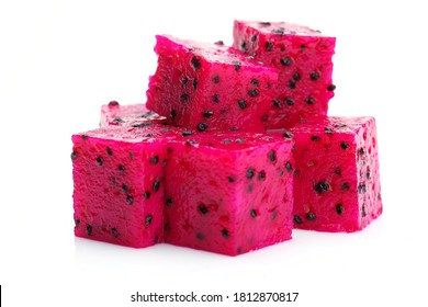 Red Dragon fruit (Pitaya) cut pieces, cubes isolated on white background.Close up