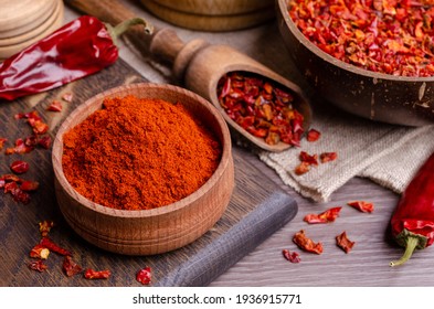 Red dried pepper on a dark wooden background. Selective focus. - Shutterstock ID 1936915771