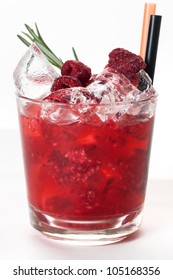 Red drink with ice and raspberries