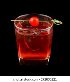 Red Drink That Contains Vodka, Rose Syrup, Grenadine And Cranberry Juice And Is Garnished With A Maraschino Cherry. Isolated On Black.