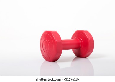 Red Dumbell. Isolated On A White Background.