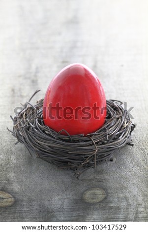 Red Easter egg in the nest