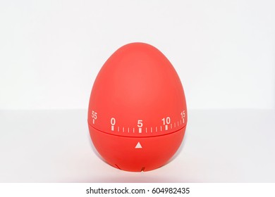 Red Egg Timer In Front Of White Background - Isolated