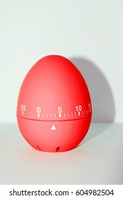 Red Egg Timer In Front Of White Background - Isolated