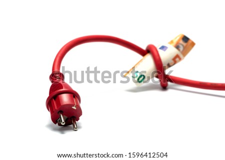 Red electric cable with plug tied to a knot on a roll of euro banknotes isolated on white. Cost of electricity and expensive energy concepts. 