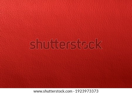 Red elegance leather texture for background with visible details.