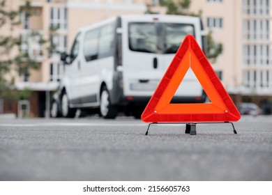 Red Emergency Triangle Stop Sign On Road