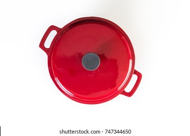 Red Enameled Cast Iron Covered Dutch Oven On A White Background.