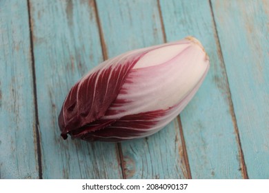 Red Endive On A Wooden Table