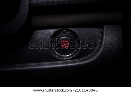 Red engine start and stop button, The dashboard shows the details of the push-button start in the car. car engine that starts and stops with the push of a button. technology in the car