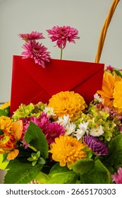 Red envelope gift present idea Flower delivery Selective focus Bush of autumnal orange red chrysanthemums and violet dahlia hydrangea. Fall garden beautiful flowers bouquet background. Blooming