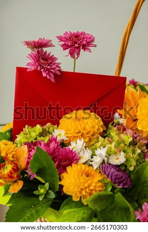 Red envelope gift present idea Flower delivery Selective focus Bush of autumnal orange red chrysanthemums and violet dahlia hydrangea. Fall garden beautiful flowers bouquet background. Blooming