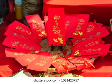 Red envelopes Lunar New Year Calligraphy decorated with text "Merit, fortune, longevity" in Vietnamese means anyone receives money from envelope will be lucky, successful, make a lot of money