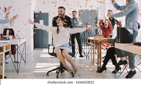 RED EPIC-W Happy fun young brunette business woman celebrating birthday at party with office colleagues slow motion. - Powered by Shutterstock