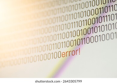 Red "error!" message within binary code on screen. Digital representation of a fault, signaling a critical system crash and potential cyber threats