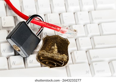 A red ethernet cable on a computer keyboard with a padlock and policeman's badge symbolizing internet security