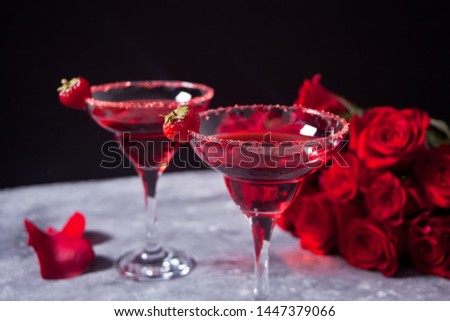 Red exotic alcoholic cocktail in clear glasses