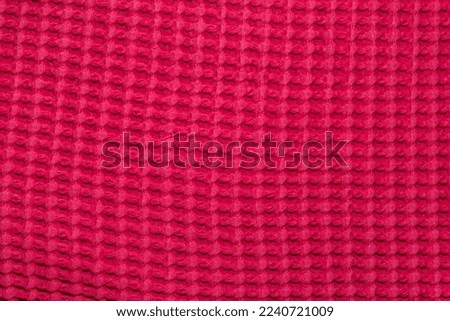 red fabric with woven tile pattern - waffle pique, tiled, background