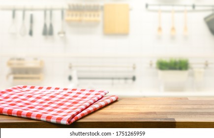 Red Fabric,cloth On Wood Table Top On Blur Kitchen Counter (room)background.For Montage Product Display Or Design Key Visual Layout.