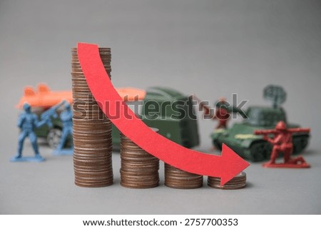 Red falling down red graph and stack coins with soldier fights, weapon war background. The global economic impact of the war, recession, energy crisis, oil price hike supply shortage and so on concept